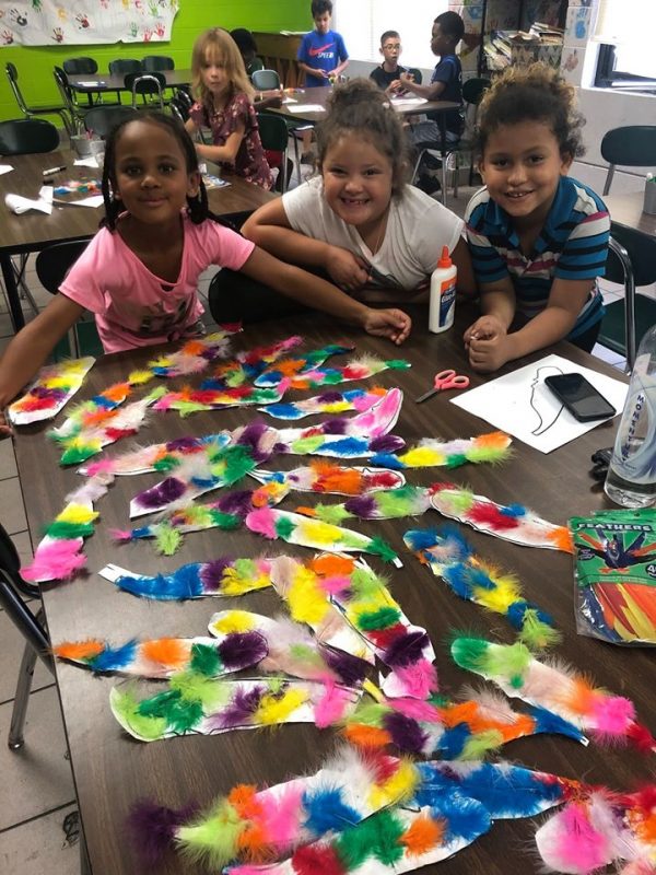 girls and boys doing crafts at Boys and Girls Club Sandhills